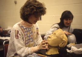 Photograph of students in the Funeral Services program working on a mannequin head