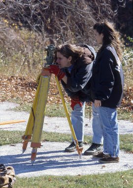 Photograph of Civil Engineering students using surveying equipment