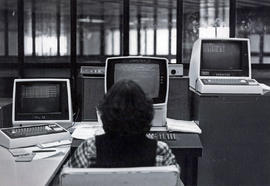 Photograph of a Computer Operator Sitting at the Main Control Room