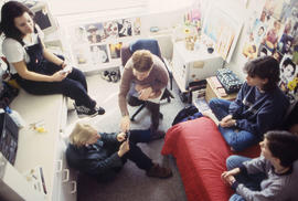 Photograph of students gathered in a residence dorm