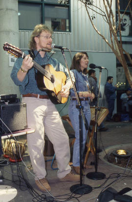 Photograph of two performers performing at an event in the Student Centre
