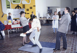 Photograph of a limbo dance contest for Nutrition Week