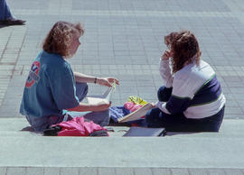 Photograph of two students in conversation with each other