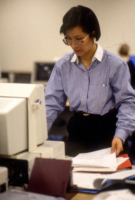 Photograph of a faculty member working at a computer