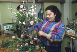 Photograph of students creating a floral arrangement