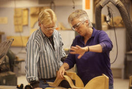 Photograph of a faculty and student in the woodworking lab