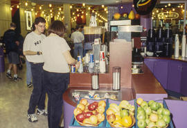 A photograph of students at a food counter in the Food Emporium