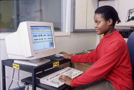 Photograph of a Radio broadcasting student at the computer