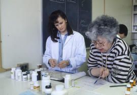 Photograph of a Pharmacy Assistant Working With Their Instructor
