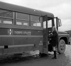 Photograph of a student boarding a Humber shuttle bus