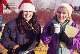 Photograph of Two Women Smiling at the Christmas Tree Sale and Family Event