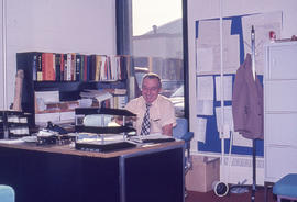 Photograph of Physical Resources Maintenance Manager at his desk