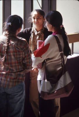 Photograph of students in the entrance hallway near the main E building stairwell