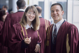 Photograph of Two Graduates in the Hallway