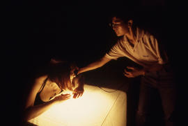Photograph of photography student using a light meter