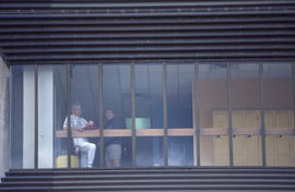 Photograph of Two Students Looking Out the Window