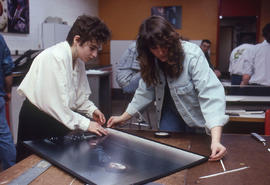 Photograph of Media Studies students working with oversized prints