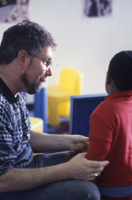 Photograph of a child and educator at the daycare centre