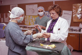 Photograph of an instructor and students during an Operating Room Nurse training exercise