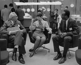 Photograph of Lloyd Lake Sitting With Donna MacManus and Glenn Harewood at a Communications Confe...