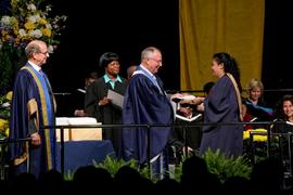 President John Davies with student at graduation : [photograph]