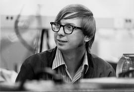 Photograph of a Student sitting in an Electronics Lab