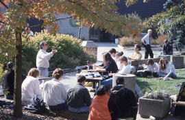 Photograph of an Instructor Lecturing Outside