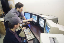Photograph of Media Students Working at an Audio Visual Console