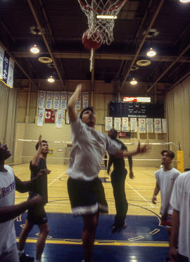 Photograph of students playing basketball