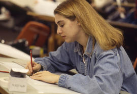 Photograph of a student working on an assignment at a drafting table