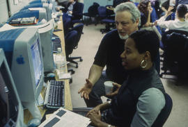 Photograph of Professor Carey French assisting a student