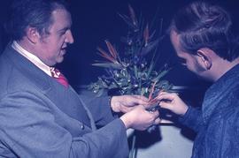 Faculty member Russ Geddes (left) showing a floral arrangement : [photograph]