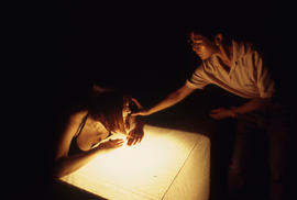 Photograph of a photography student using a light meter