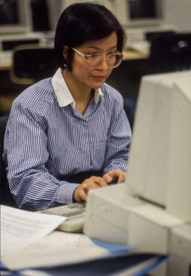 Photograph of a staff member working at a computer