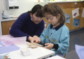 Photograph of an Early Childhood Education student working with a child