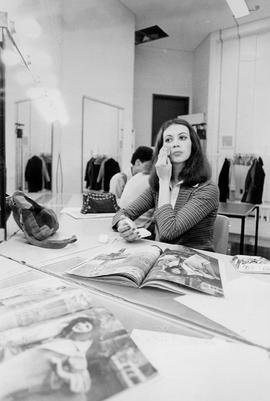 Photograph of a Student Applying Makeup in the Fashion and Modelling Lab