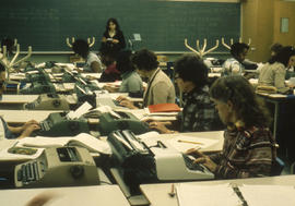 Photograph of students in a class typing
