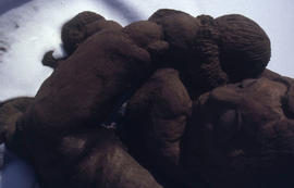 A photograph of a sculpture of a mother and child