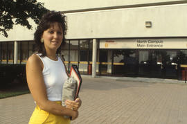 Photograph of an unknown person posing at the main entrance