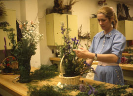 Photograph of Retail Floristry student working on an arrangement
