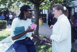 Photograph of a A SAC Rep Talking With a Student
