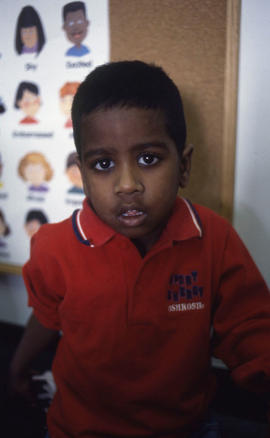 Photograph of a toddler posing for the camera