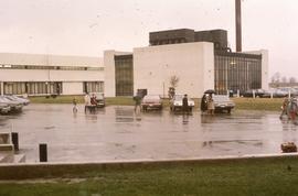 Parking lot in front of power plant : [photograph]