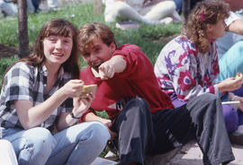 Photograph of persons seated on the grass