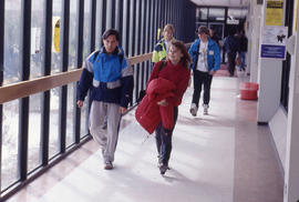 Photograph of Students Walking In a Main Hallway