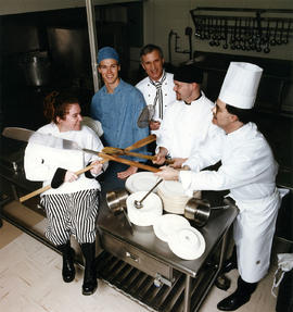 Photograph of President Robert Gordon posing with students