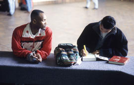 Photograph of Two Students Sitting in the Concourse