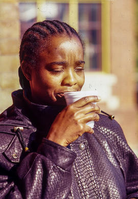 Photograph of student drinking coffee