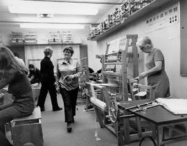Photograph of Weaving Students Working with Looms