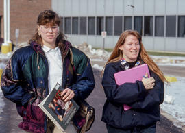 Photograph of two students walking outdoors